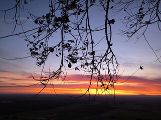 Horizontal shot of a sunrise from a valley