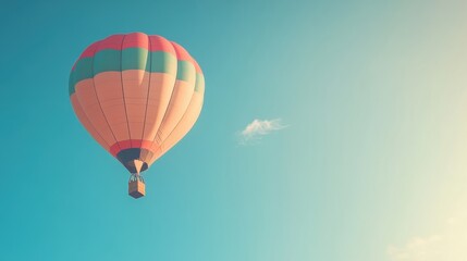 Fototapeta premium Colorful hot air balloon floating in clear blue sky on a sunny day
