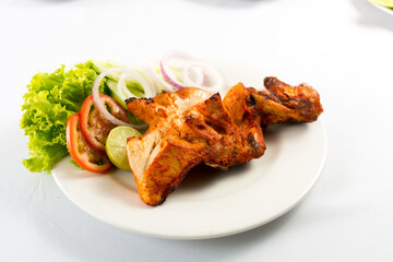 grilled chickens tikka with lemon, union, tomato and chilly powder.
