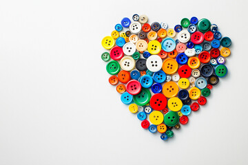 Colorful buttons arranged in heart shape design