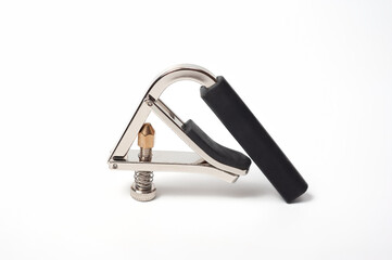 Modern technological, metal capo with a spring clamp for guitar.
