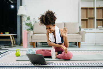 Obraz premium A young woman practices yoga and stretching with a mat and gym props, showcasing wellness, motivation,