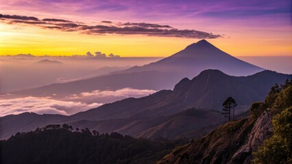 Obraz premium Warm sunset light illuminating mountain ridges and valleys blanketed in clouds, with a majestic volcano rising in the background, creates a breathtaking panorama of the guatemalan highlands