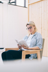 Pondering female copywriter thinking on literature plot for sharing information to website via...