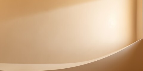 Obraz premium A smooth, curving surface in warm beige tones, featuring soft light and subtle shadows, creating an elegant and modern aesthetic.