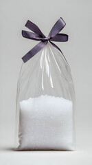 White Crystals in Cellophane Bag, Purple Ribbon