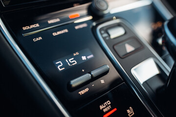 A dashboard view of a cars with climate control and heating options
