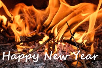 Concept de souhaiter une bonne année sur fond de feu de bois