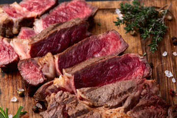 Ribeye grilled  beef steak sliced . Rare doneness photography . Top view