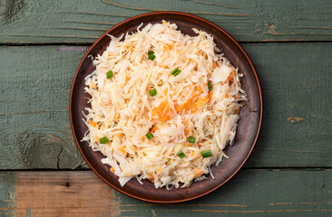 Tasty marinated cabbage with carrot, healthy food  Sauerkraut photography . Top view