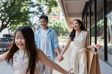 Joyful Family Shopping Experience with Parents and Children Enjoying a Day Out Together in a Modern...