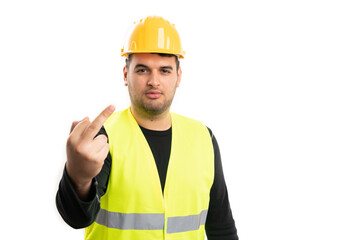 Angry builder man showing middle finger as offensive gesture