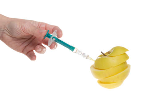 Apple cut receiving an injection for rapid ripening hand holding syringe on isolated white png transparent background