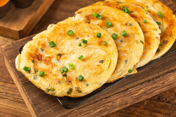 Green onion pancakes are a fried Chinese flatbread often eaten as a snack or with a meal.