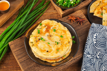 Green onion pancakes are a fried Chinese flatbread often eaten as a snack or with a meal.