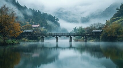 Fototapeta premium Misty Mountain Bridge Reflecting in Calm Water