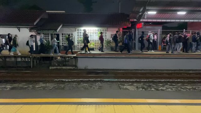 Tangerang, Indonesia - October 30, 2024: Passenger of KRL Commuterline, commonly known as Greater Jakarta Commuter rail, Jakarta Commuter rail seen at Cisauk Station, Tangerang, Indonesia