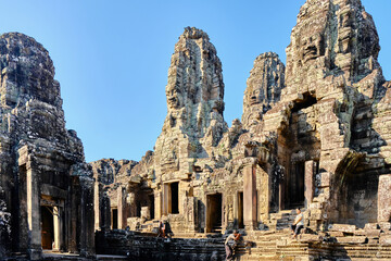 Naklejka premium Siem Reap, Cambodia, 12 Jan 2024: Bayon is a temple complex in the center of Angkor Thom, built in the XII century in honor of Jayavarman VII.