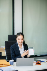 young female lawyer handling legal documents at her office desk