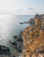 View of the vastness of the Pacific Ocean from the high seashore. High cliffs on the shore of the Pacific Ocean.