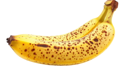 Ripe banana showcasing vibrant yellow skin and distinctive black spots against a bright yellow background