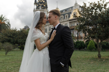 A Beautiful and Truly Romantic Wedding Moment is Happening in a Charming Elegant Outdoor Setting