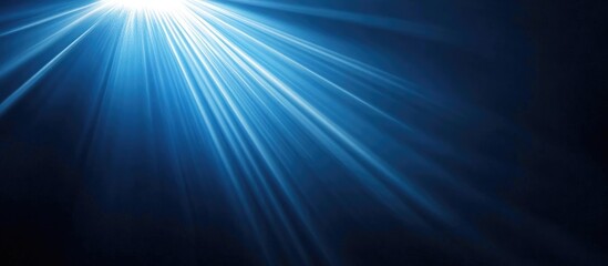 Serene dark blue sky illuminated by sunlight with a distinctive vapor trail from an airplane creating a peaceful atmosphere.