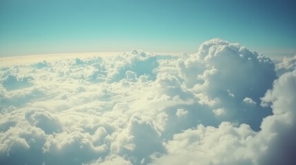 Naklejka premium Vintage style image showcasing fluffy clouds against a bright blue sky with a tranquil atmosphere and soft color tones.