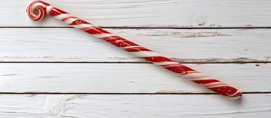 Christmas candy cane decoration on rustic white wooden background for festive holiday imagery and seasonal design concepts