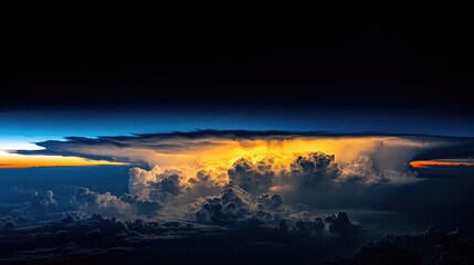 Majestic cloud formation illuminated by sunlight breaking through dark storm clouds against a dramatic black sky backdrop