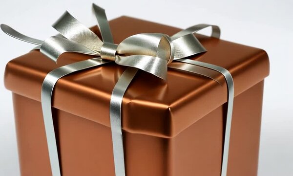 Coffret cadeau couleur cuivre avec ruban m&eacute;tallique argent&eacute;, emballage raffin&eacute; pour f&ecirc;tes, anniversaires, &eacute;v&eacute;nements ou No&euml;l, sur fond blanc avec espace n&eacute;gatif copyspace