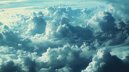 Fototapeta premium Aerial view of dramatic clouds and blue sky as seen through an airplane window during flight showcasing natural beauty and tranquility.