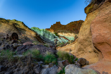 Detail of the colors in the Natural Monument Azulejos de Veneguera or Rainbow Rocks in Mogan, Gran...