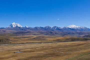 Tagong Grassland under the snow mountain of Ganzi Yala, Sichuan Province, China