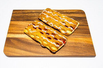  sweet and delicious strawberry  pastry on a wooden board