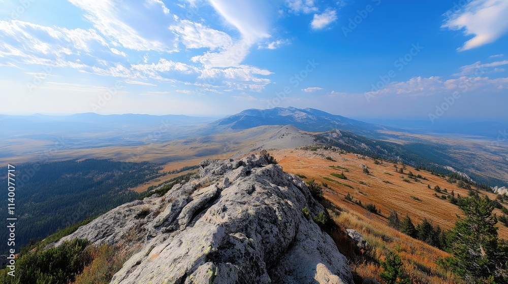 Poster scenic view of a distant mountain summit overlooking vast landscapes under a bright blue sky with wi
