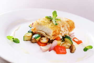 fries fish with organic vegetables