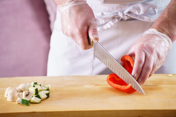 .Chef cutting fresh and delicious vegetables for cooking