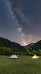 Camping beneath a dazzling starry sky in Chiang Phillip, Thailand, with tents glowing softly in the dark landscape