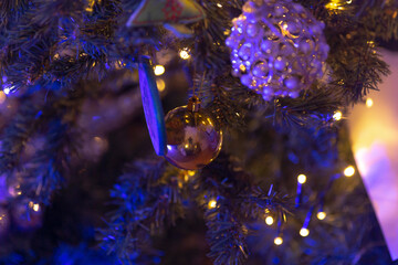 This image features a closeup view of a beautifully decorated Christmas tree, adorned with festive...