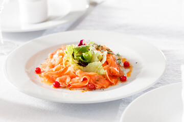fish carpaccio on the white plate