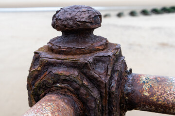 Aged and weathered old ironwork railings at coast