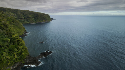 Flight along the Maui forest jungle coast line after rain season