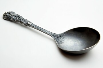Ornate silver ladle, floral design, white background.