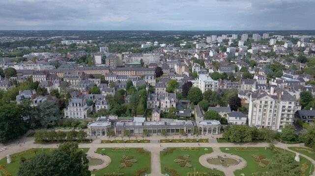 Beautiful panoramic drone movement towards the Parc du Thabor botanical garden, Rennes, France.