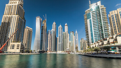Naklejka premium Dubai Marina towers in Dubai at day time timelapse hyperlapse