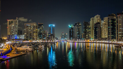 Dubai Marina towers and yachts in Dubai at night timelapse hyperlapse