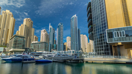Naklejka premium Dubai Marina towers in Dubai at day time timelapse hyperlapse
