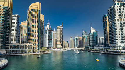 Fototapeta premium Dubai Marina towers and canal in Dubai timelapse hyperlapse