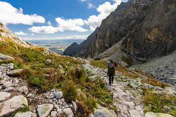 woman is hiking around Téryho chate, high tatra, slovakia